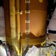 A view of SLS inside the Vehicle Assembly Building at NASA’s Kennedy Space Center, showing the tops of the side rocket boosters.